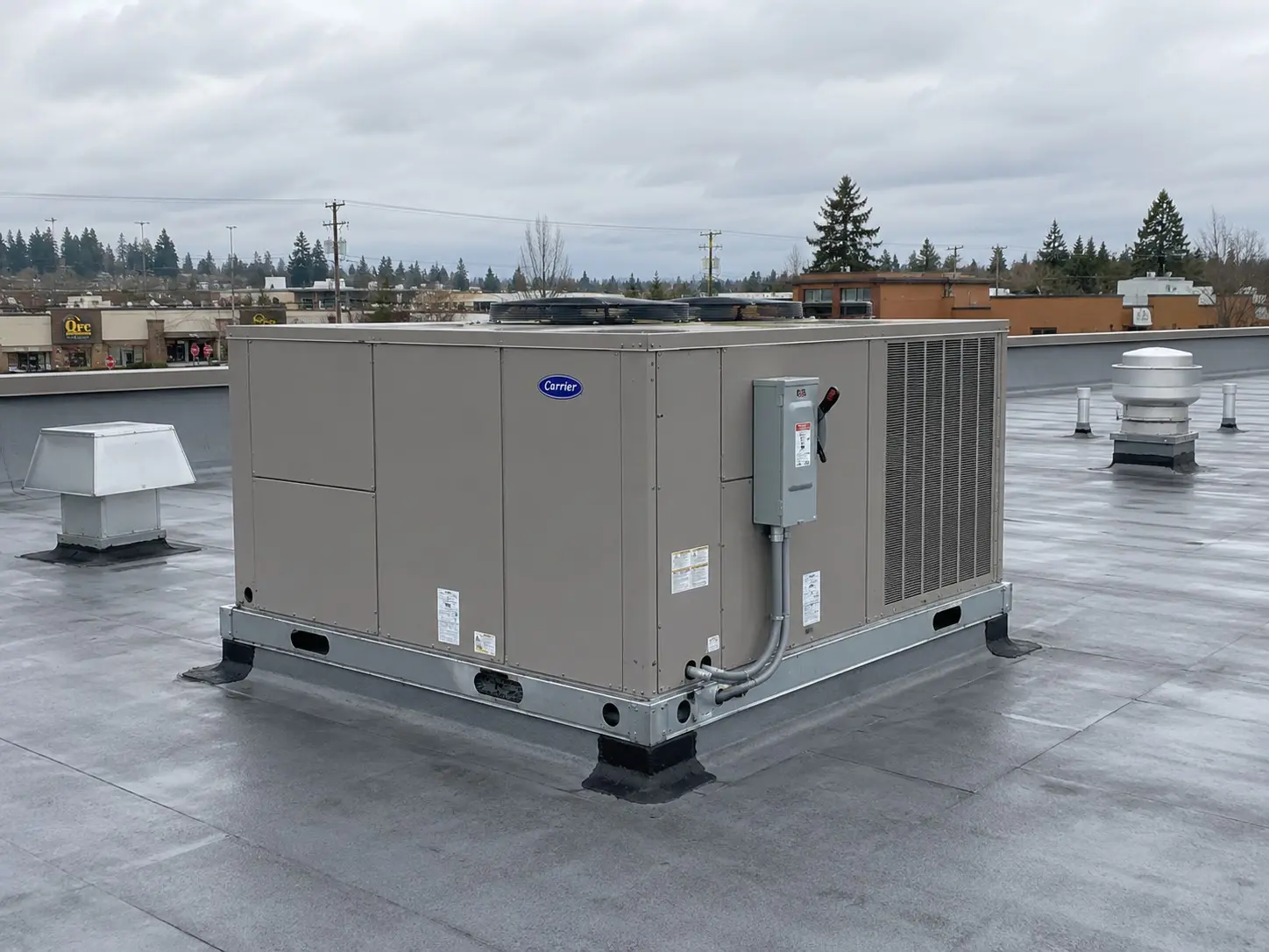 Carrier rooftop packaged HVAC unit on a Pierce County, WA commercial building