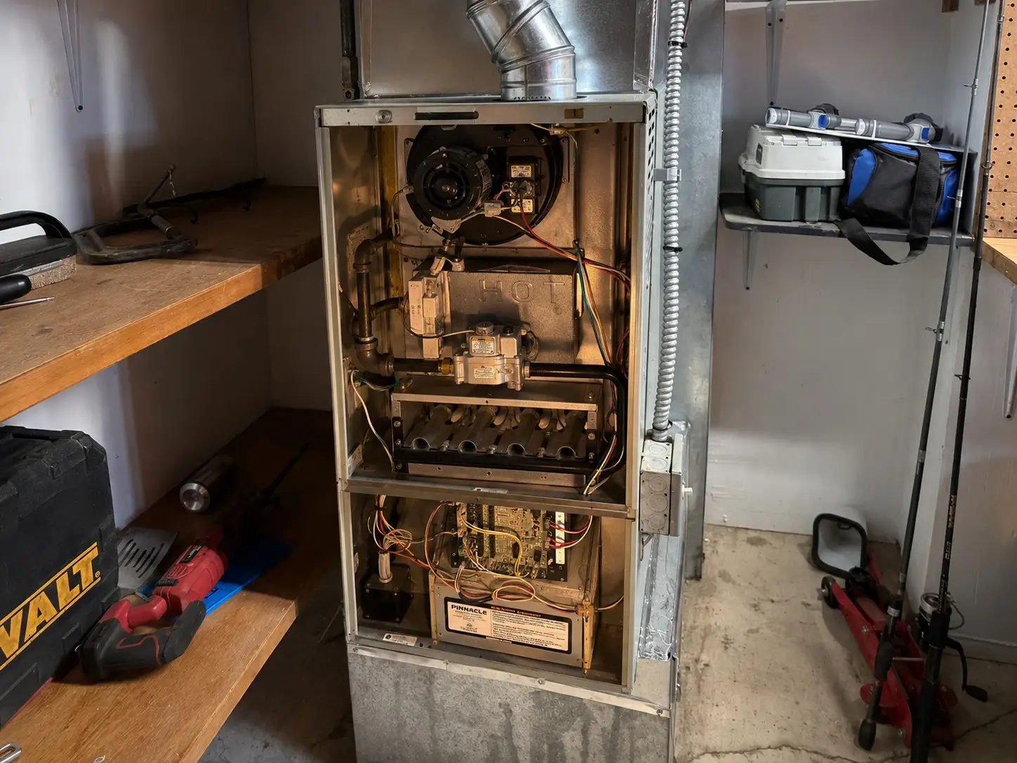 Furnace repair in Puyallup, WA — gas furnace opened up for service by Pinnacle Air Control