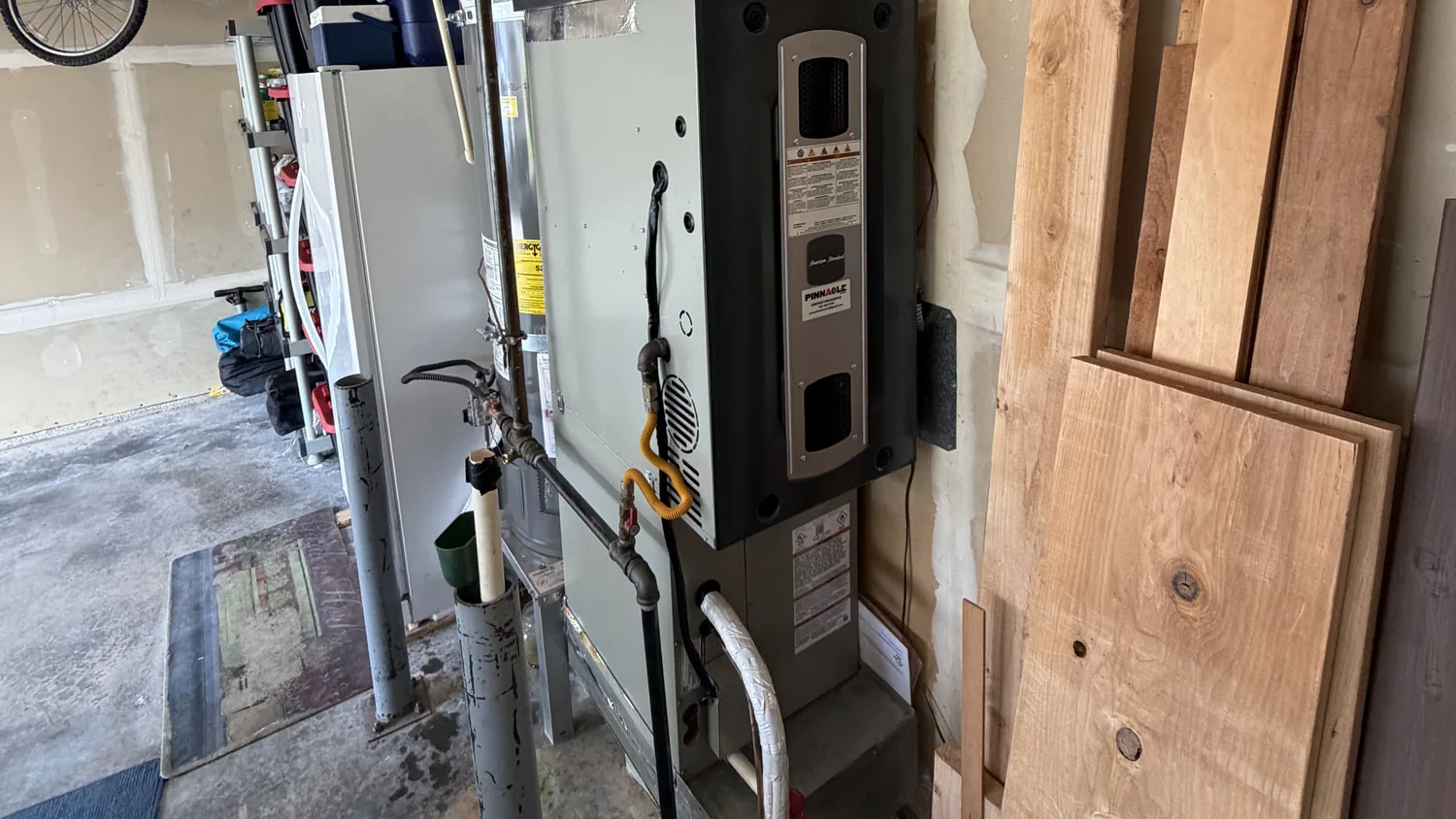 American Standard gas furnace with a Pinnacle Air Control label in a Pierce County, WA garage