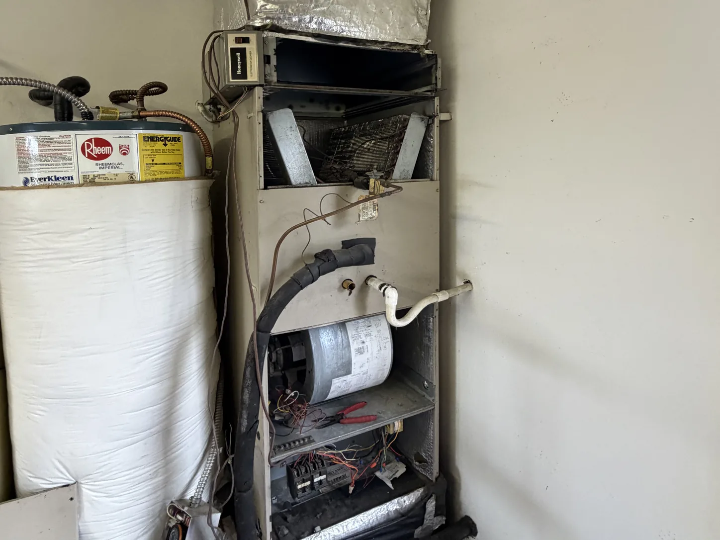 Furnace repair in Puyallup, WA: Lennox electric furnace opened up by Pinnacle Air Control with the blower and controls exposed